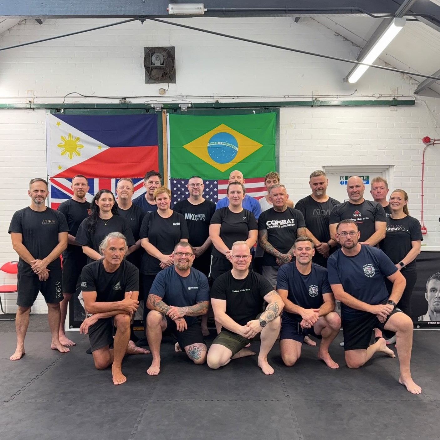 Group photo — MKG seminar with Filipino, Brazilian and UK flags